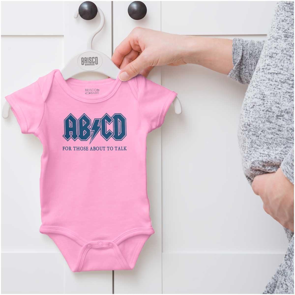 imageBrisco Brands Cutest Lil Rockstar Music Lover ABCD Baby Romper Boys or GirlsAbcd Pink