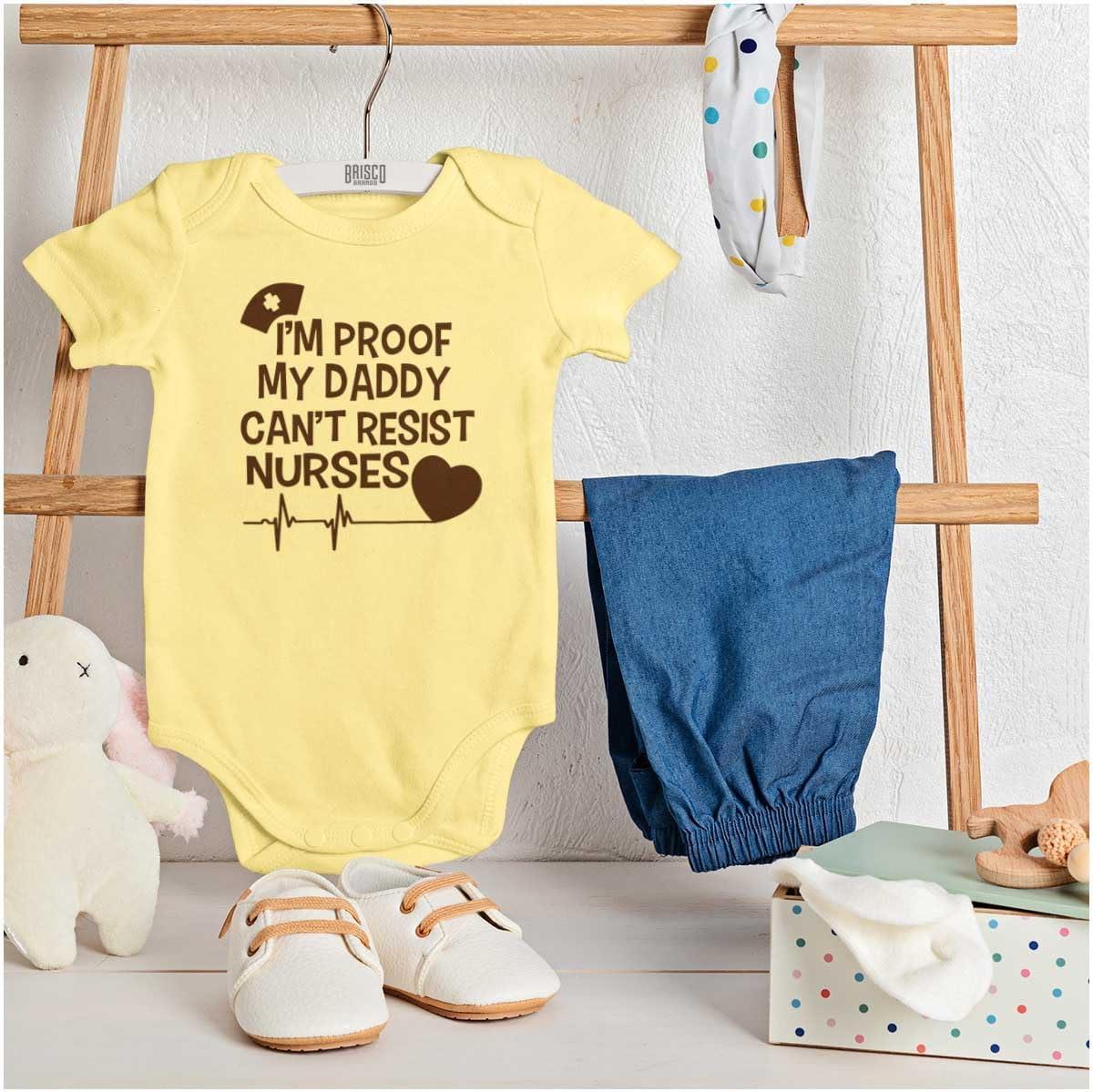 imageBrisco Brands Proof Daddy Cant Resist Nurses Heart Baby Romper Boys or GirlsBanana