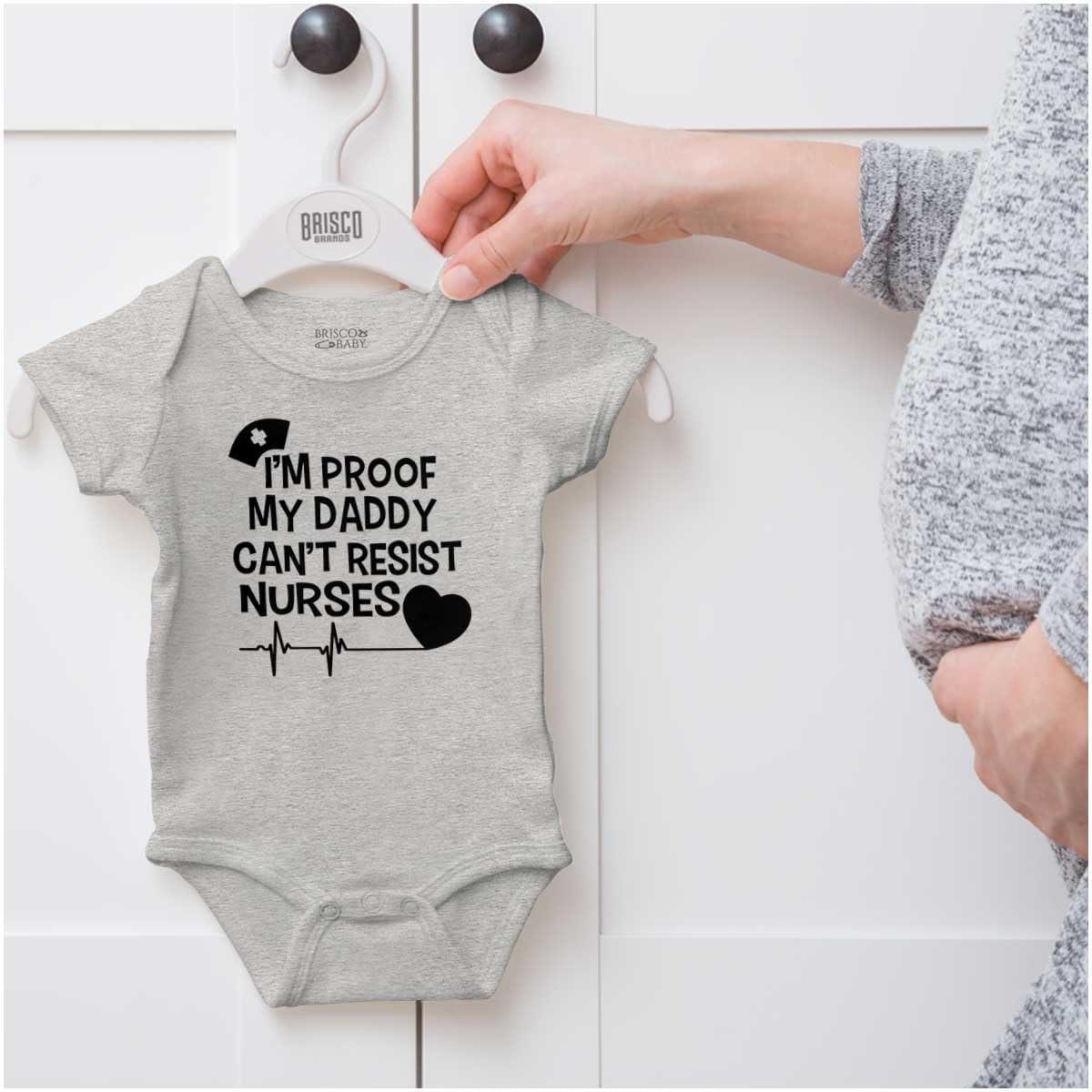 imageBrisco Brands Proof Daddy Cant Resist Nurses Heart Baby Romper Boys or GirlsHeather