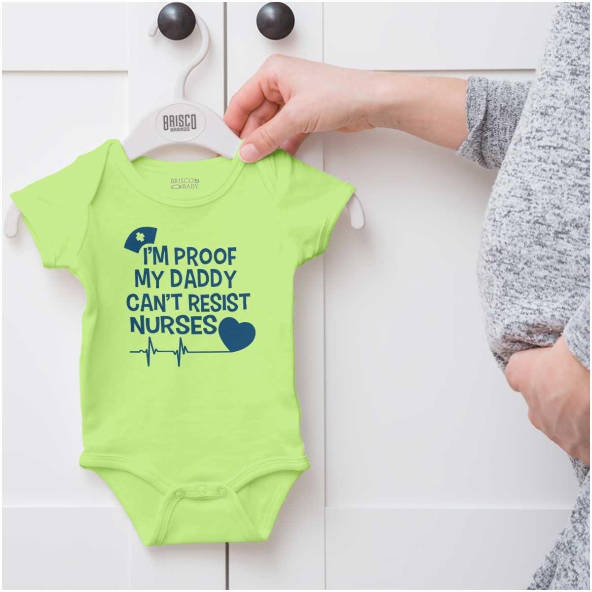 imageBrisco Brands Proof Daddy Cant Resist Nurses Heart Baby Romper Boys or GirlsKey Lime