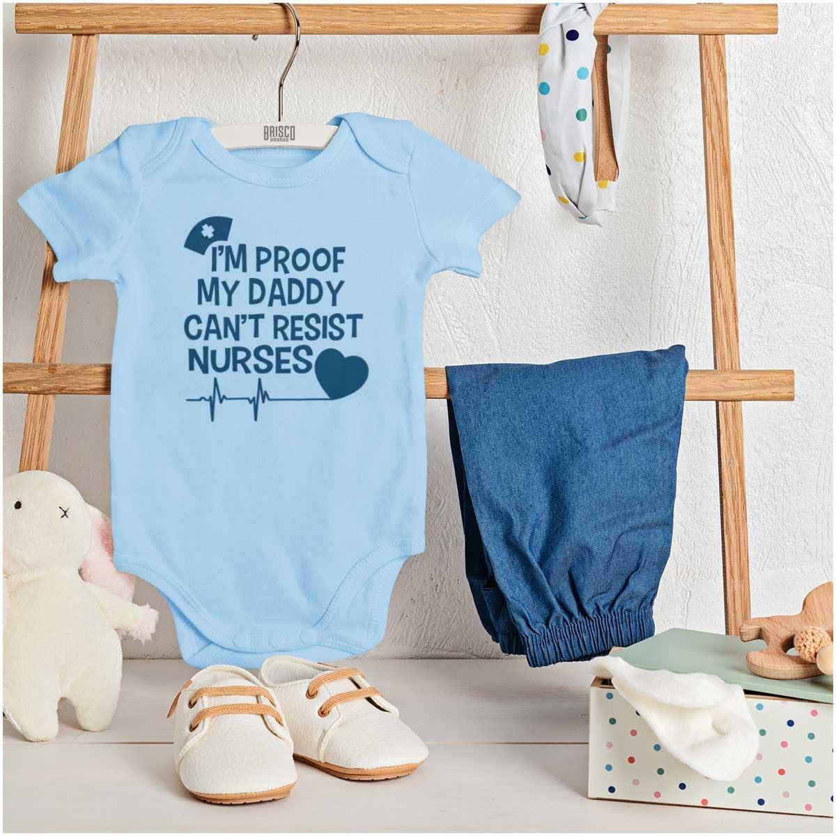 imageBrisco Brands Proof Daddy Cant Resist Nurses Heart Baby Romper Boys or GirlsLight Blue