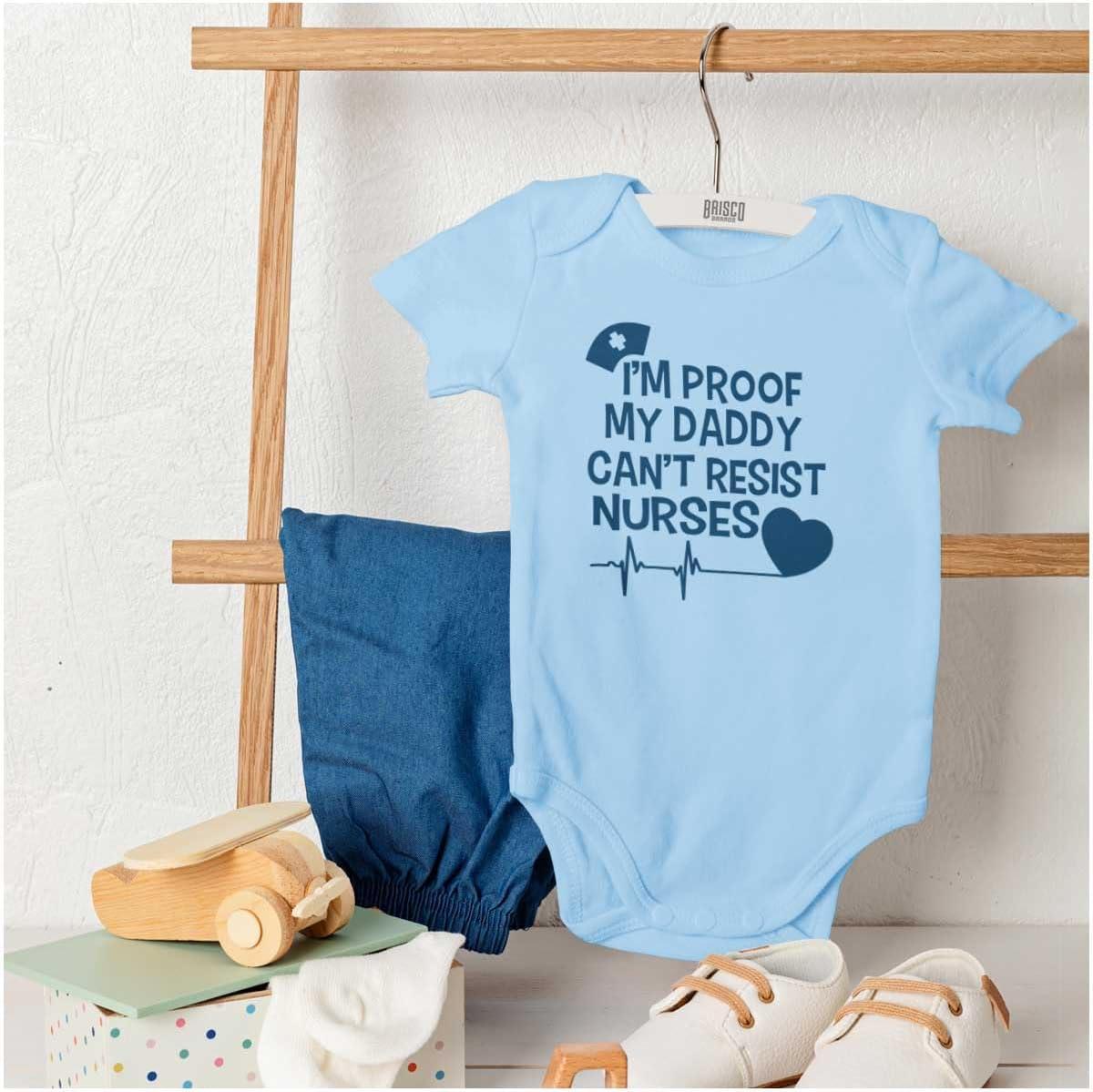 imageBrisco Brands Proof Daddy Cant Resist Nurses Heart Baby Romper Boys or GirlsLight Blue