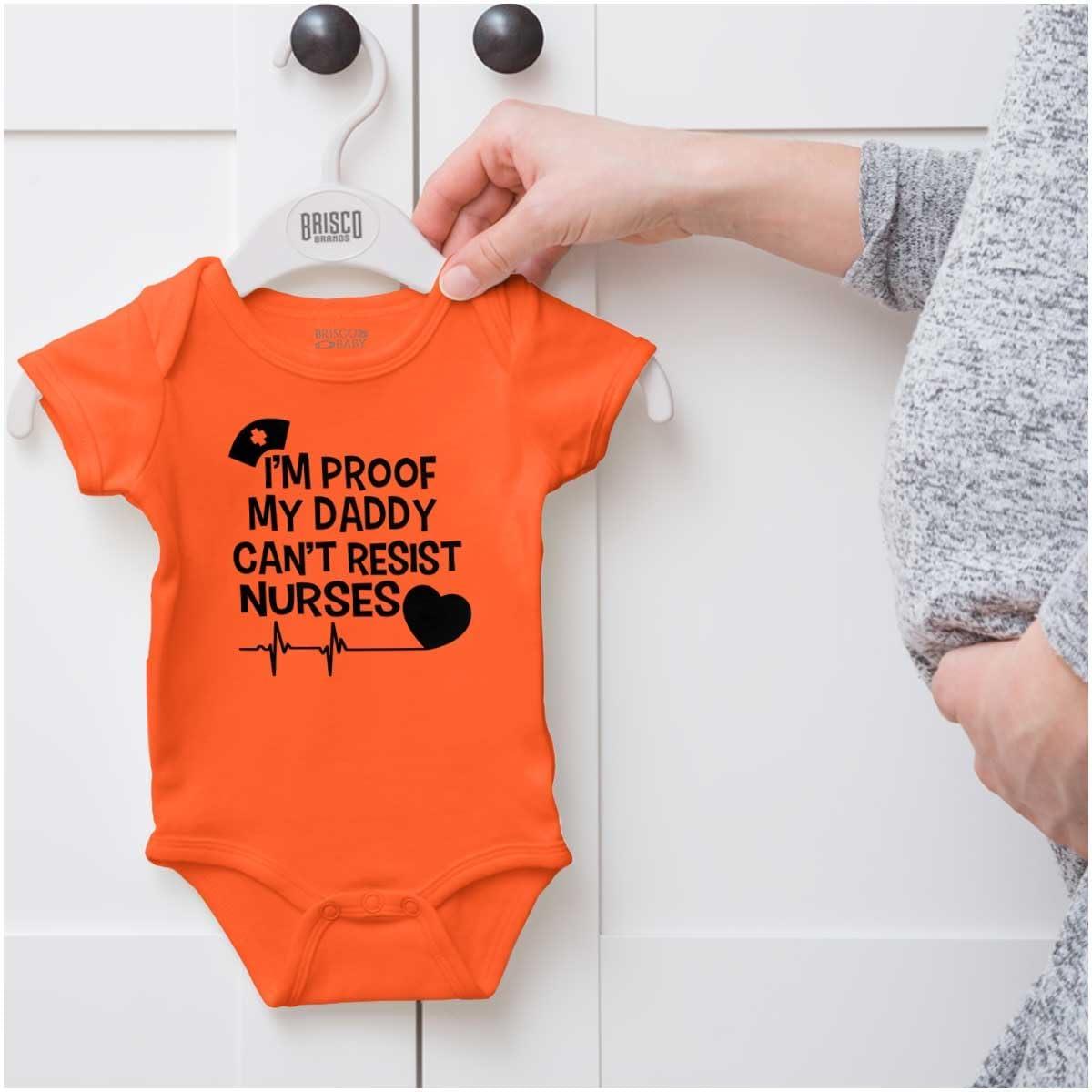 imageBrisco Brands Proof Daddy Cant Resist Nurses Heart Baby Romper Boys or GirlsOrange