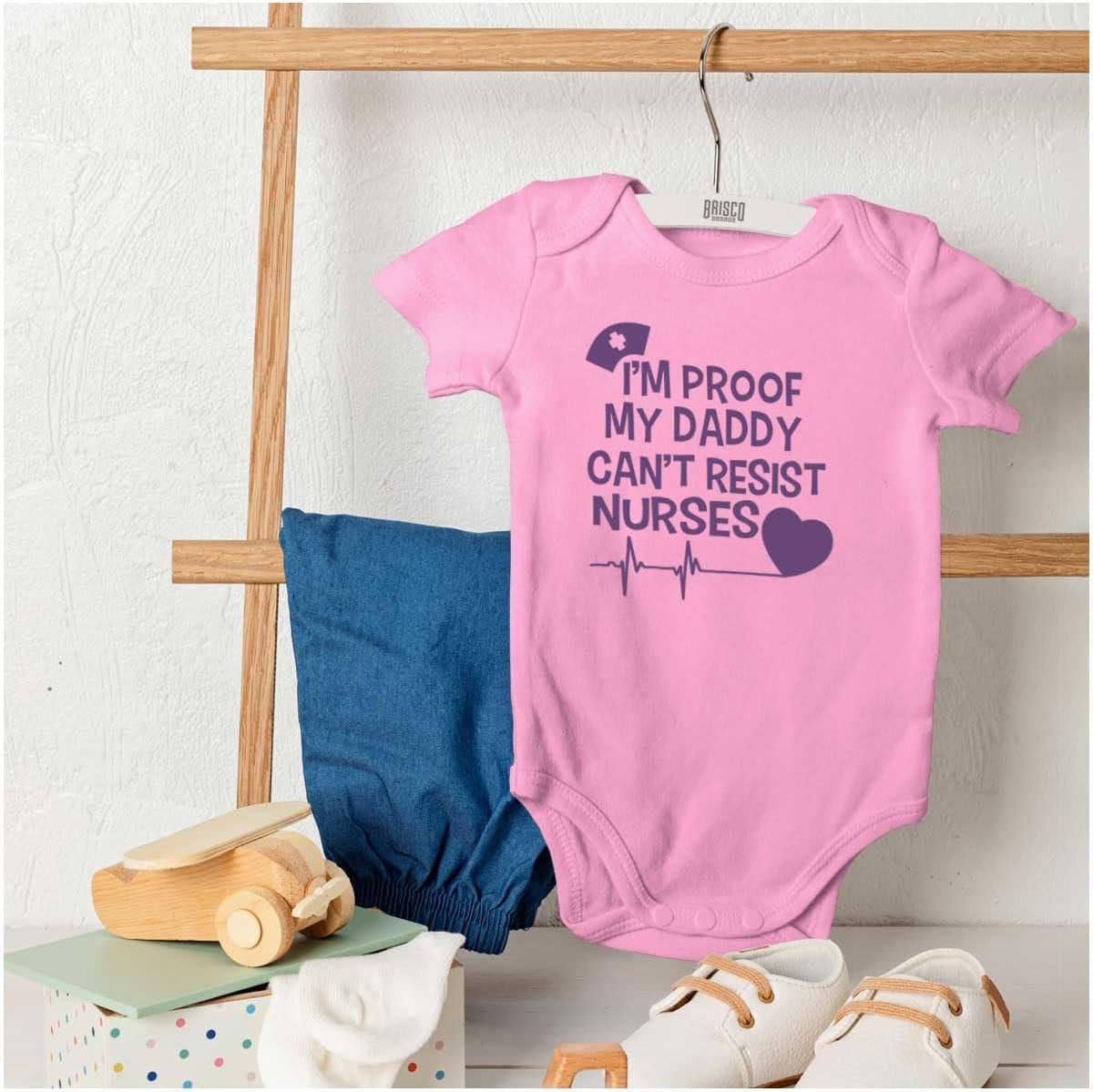 imageBrisco Brands Proof Daddy Cant Resist Nurses Heart Baby Romper Boys or GirlsPink