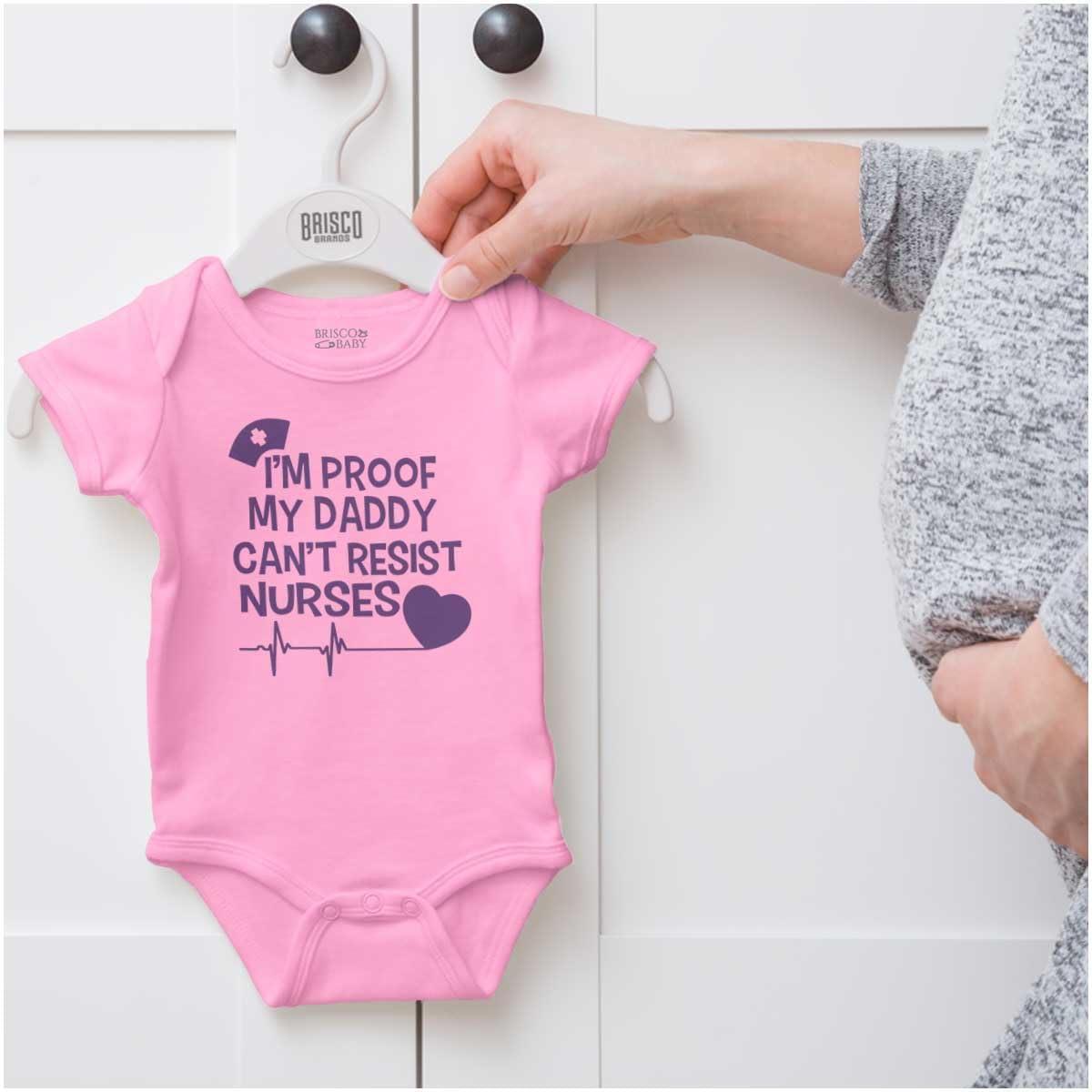 imageBrisco Brands Proof Daddy Cant Resist Nurses Heart Baby Romper Boys or GirlsPink