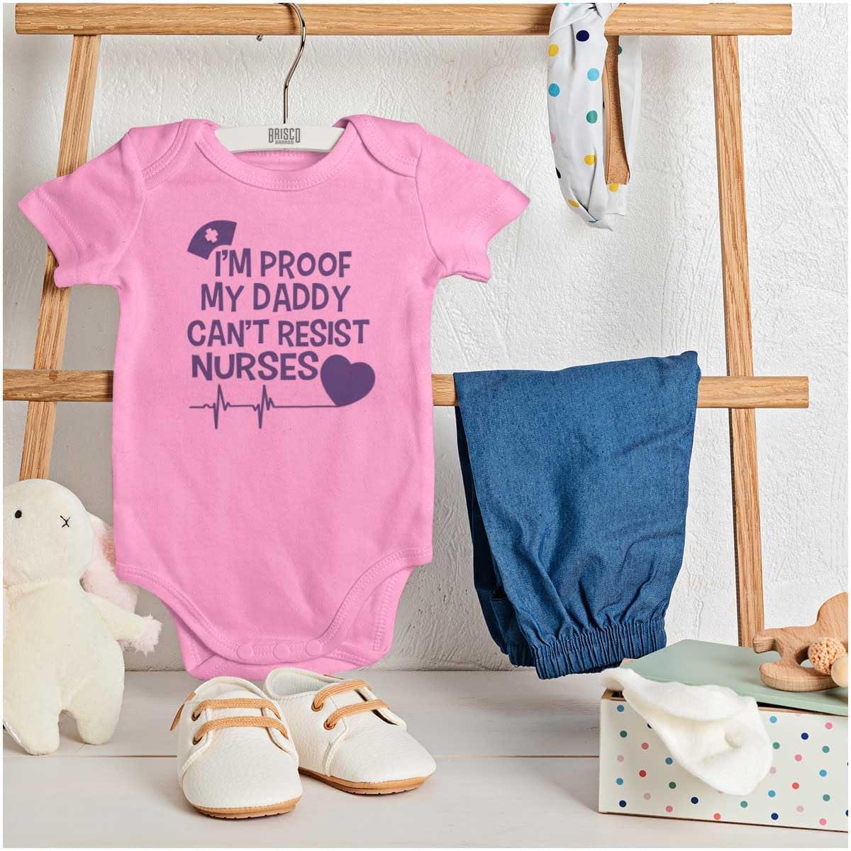 imageBrisco Brands Proof Daddy Cant Resist Nurses Heart Baby Romper Boys or GirlsPink