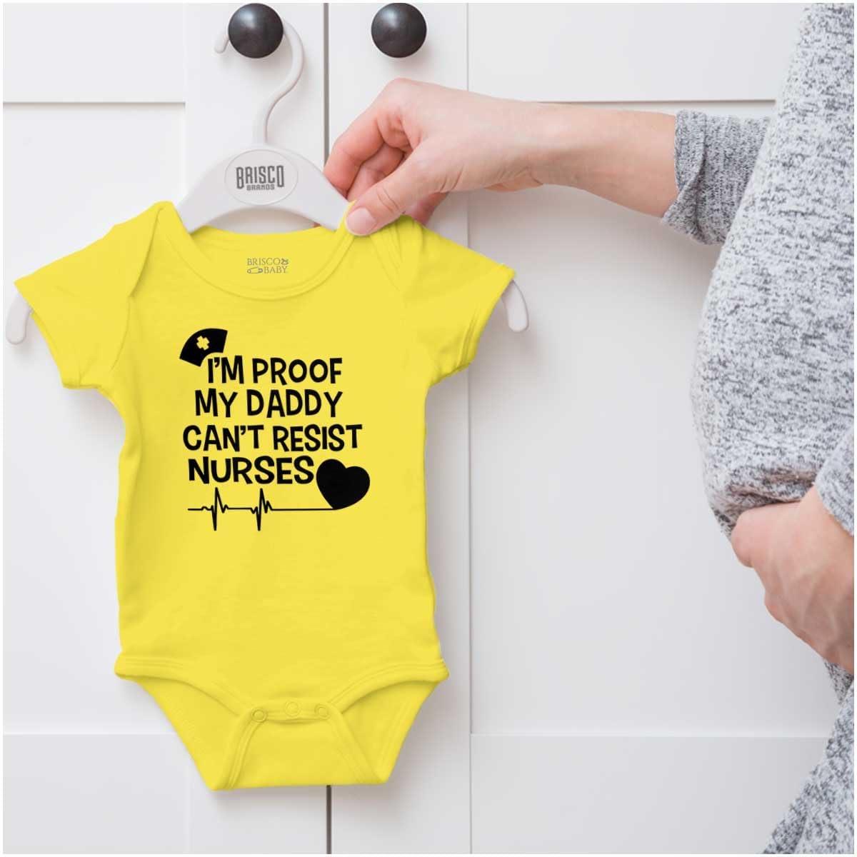 imageBrisco Brands Proof Daddy Cant Resist Nurses Heart Baby Romper Boys or GirlsZest