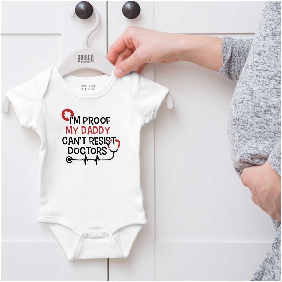 imageBrisco Brands Proof Daddy Cant Resist Doctors Baby Romper Boys or GirlsWhite