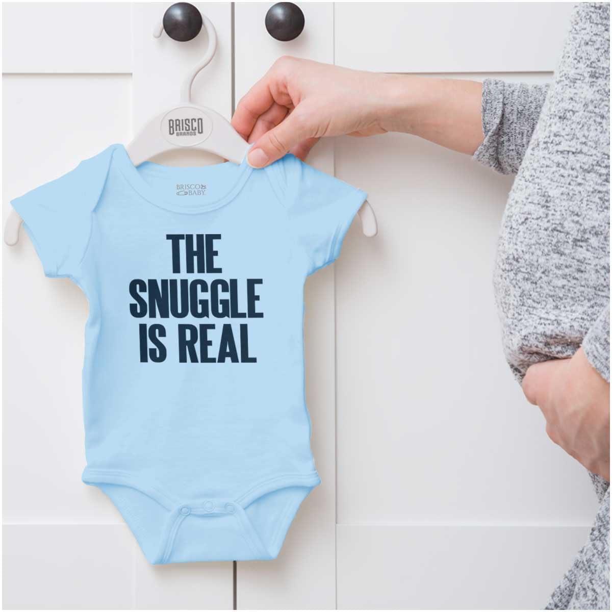 imageBrisco Brands The Snuggle Is Real Humor Pun Cute Baby Romper Boys or GirlsLight Blue